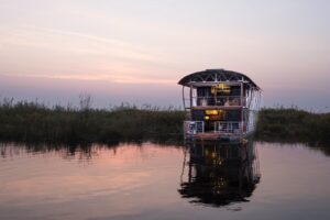 Private river villa and its reflection at dusk