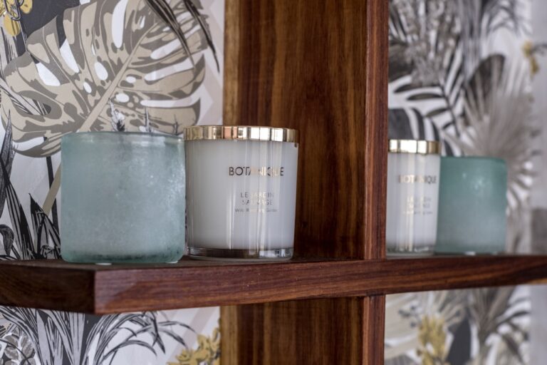 Candles and toiletries in the Namushasha River Villa bathroom