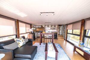 Open-plan lounge and kitchen at Namushasha River Villa
