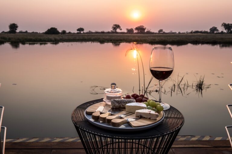Wine and cheese beside a Kwando River sunset