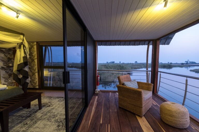 Bedroom and private deck in the exclusive-use river villa