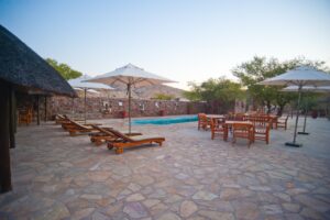 Swimming pool terrace at Omarunga Epupa-Falls Camp