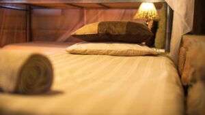 Guest bed inside Omarunga Epupa-Falls Camp accommodation
