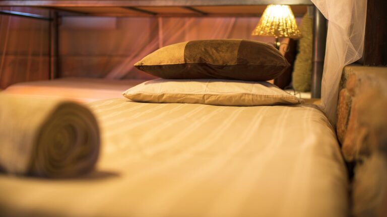 Guest bed inside Omarunga Epupa-Falls Camp accommodation