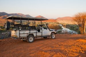 Open safari vehicle on an excursion from Omarunga Epupa-Falls Camp