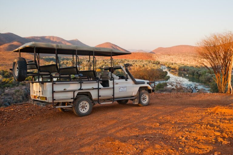 Open safari vehicle on an excursion from Omarunga Epupa-Falls Camp