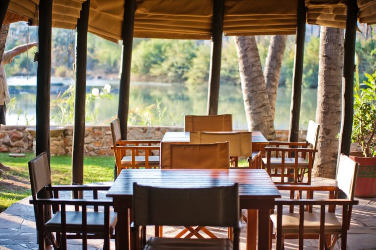 Dining table overlooking the Kunene River at Omarunga accommodation
