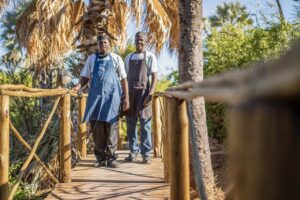 Guests and guide on a walkway at Palmwag Lodge