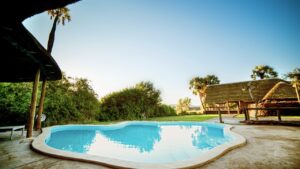 Bright swimming pool at Palmwag Lodge accommodation