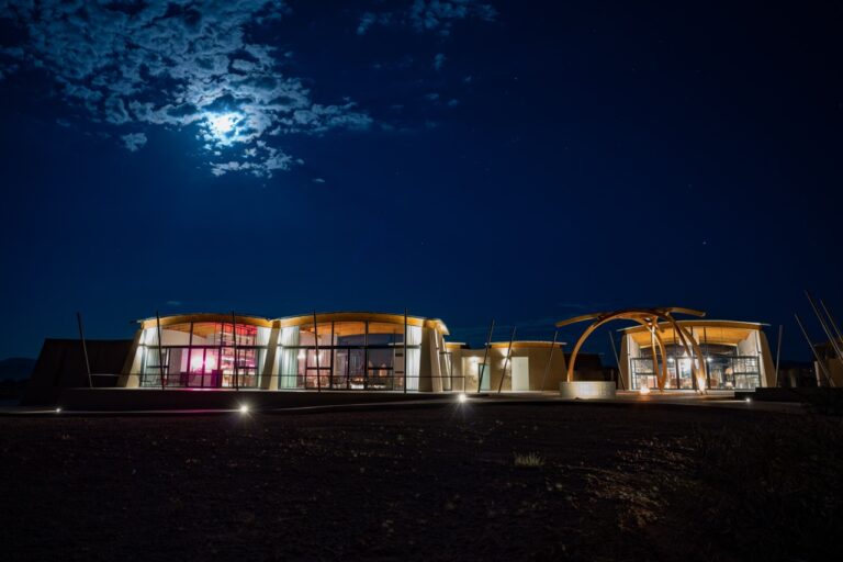 The Desert Grace central lodge beneath the night sky