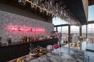 Bar counter and neon sign at The Desert Grace