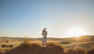 Solo traveller watching the desert near The Desert Grace