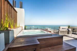 Ocean-view hot tub at The Pearls Beach Pods