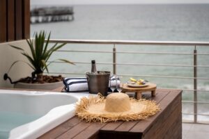 Welcome setup beside the hot tub at The Pearls Beach Pods