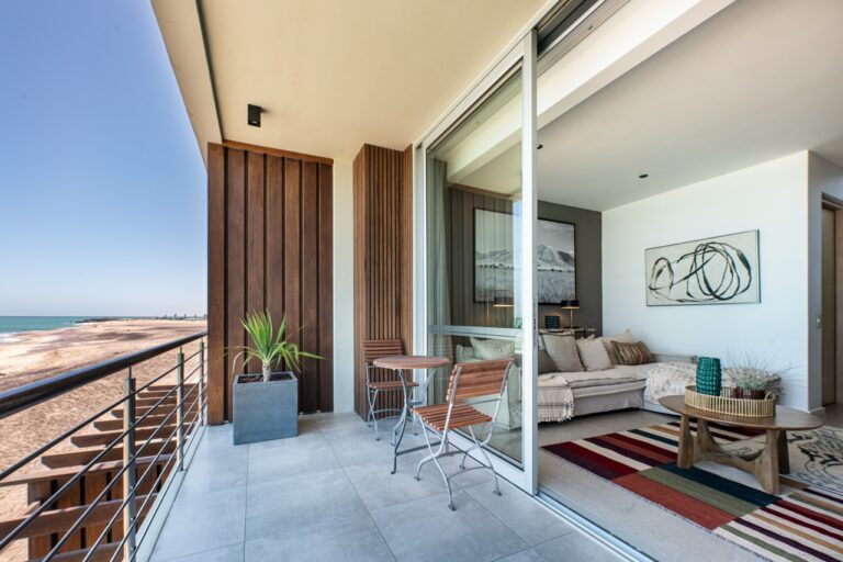 Balcony lounge with sea view at The Pearls Beach Pods
