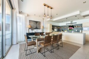 Modern kitchen and dining area in The Pearls Beach Pods