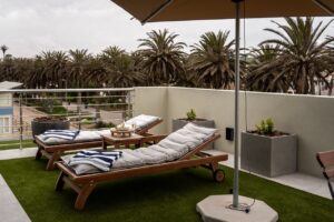 Private sun terrace at The Pearls Beach Pods beachfront accommodation