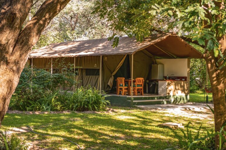Zambezi Mubala Camp self-catering safari tent beneath shady trees