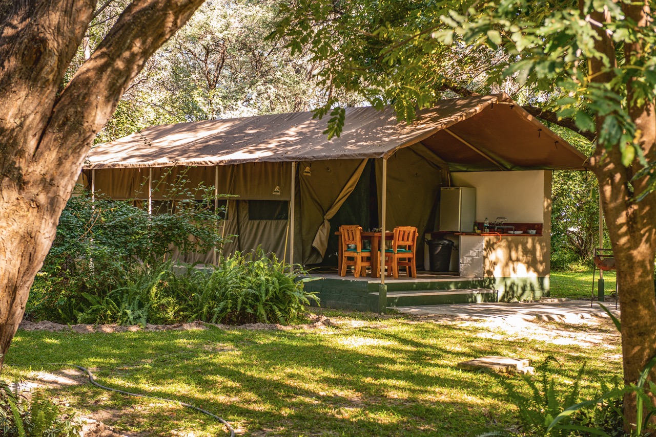 Zambezi Mubala Camp self-catering safari tent beneath shady trees
