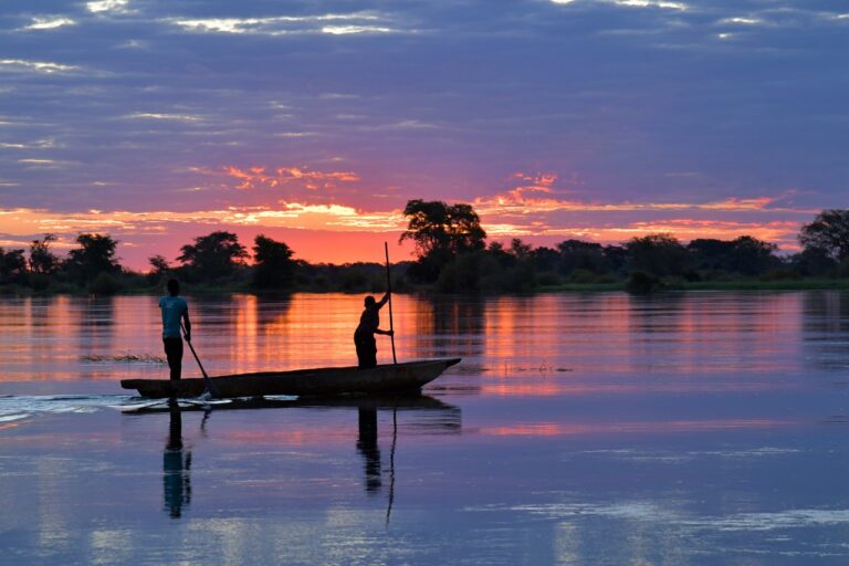 Traditional canoe on the Zambezi River near Zambezi Mubala Lodge at sunset