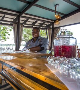 Bar service in the open-air restaurant at Zambezi Mubala Lodge