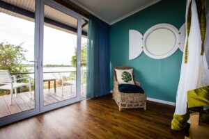 Sitting area opening onto a private river-facing deck
