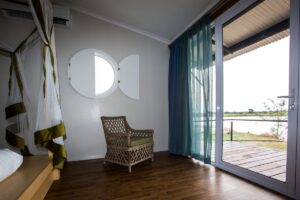 Guest room opening onto a Zambezi River deck