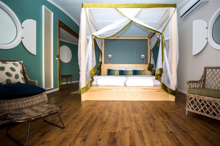 Spacious guest room with bed and sitting area at the lodge