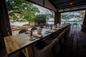 Outdoor dining table beside the Zambezi River