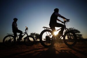 Mountain biking at sunset near Kalahari Anib Lodge