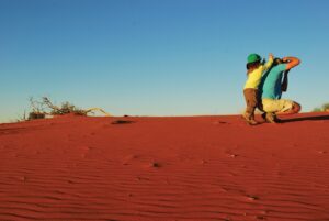 Guests photographing the red dunes near Kalahari Anib Lodge