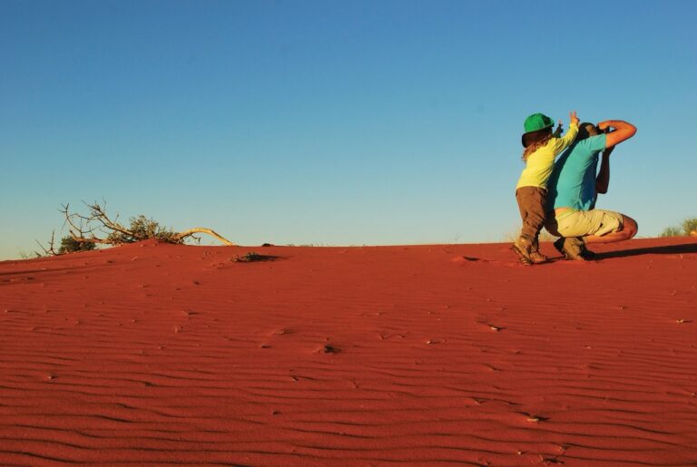 Guests photographing the red dunes near Kalahari Anib Lodge