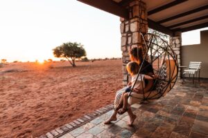 Swing chair overlooking the Kalahari landscape from a lodge room