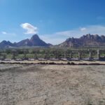 Spitzkoppe entrance sign with the granite mountains beyond
