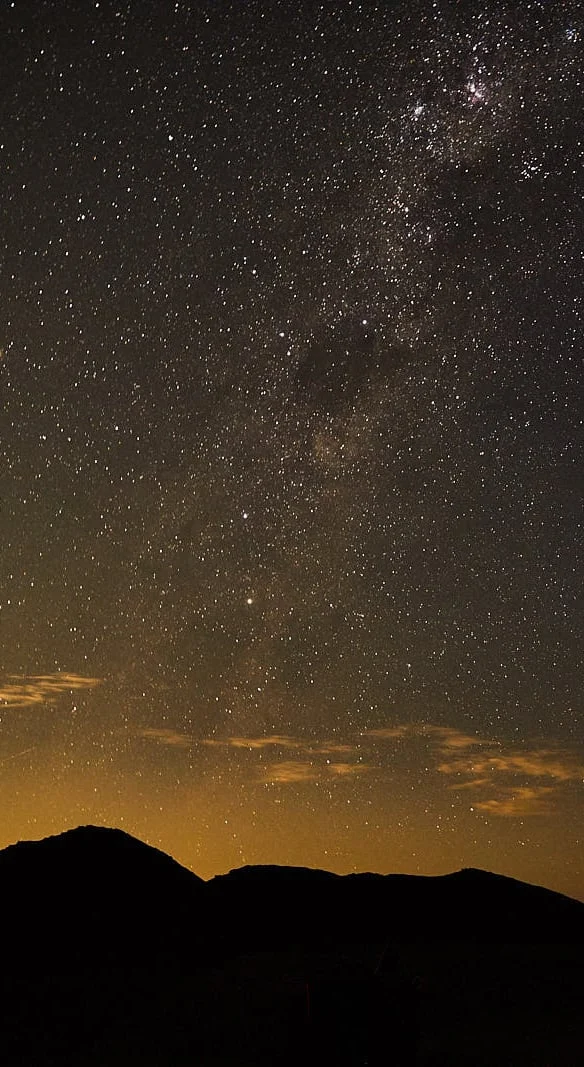 Star-filled night sky above Damaraland mountains