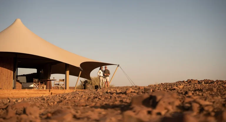 Canvas roofs and rocky landscape at Desert Rhino Camp