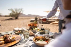 Outdoor meal served in the Desert Rhino Camp landscape