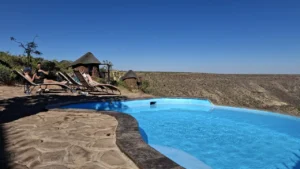 Pool and sun terrace beside the main lodge at Grootberg