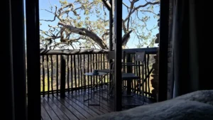 View through chalet doors onto the private deck at Grootberg Lodge