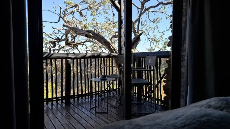 View through chalet doors onto the private deck at Grootberg Lodge