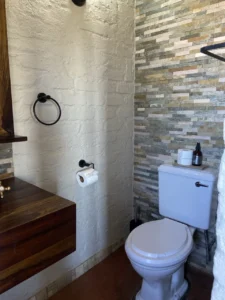 Chalet bathroom with shower and toilet at Grootberg Lodge
