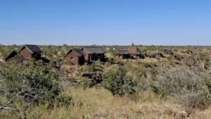 Stone-and-thatch chalets across the Grootberg plateau