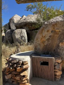 Stone wash basin and cupboard at Hoada Campsite