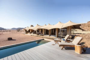 Pool and sun loungers at Hoanib Skeleton Coast Camp
