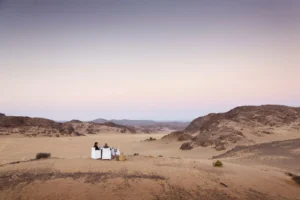 Private dining setup in the desert near Hoanib Skeleton Coast Camp