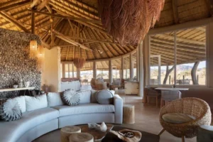 Seating beneath a thatched roof in the Little Kulala lounge