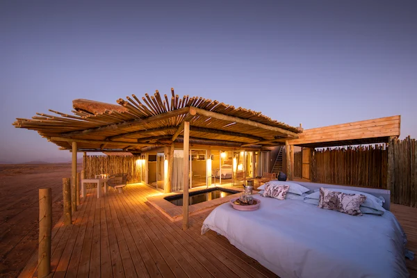 Roll-out star bed on a Little Kulala suite deck at dusk