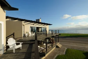Oyster Box Guesthouse exterior and raised deck beside Walvis Bay Lagoon