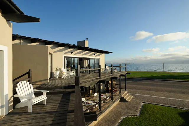 Oyster Box Guesthouse exterior and raised deck beside Walvis Bay Lagoon