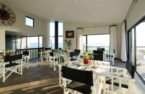 Dining room with lagoon views at Oyster Box Guesthouse